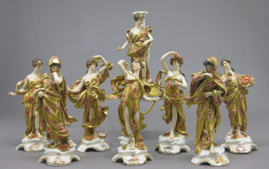 A German porcelain Capodimonte style eight-piece figural table center