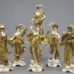 A German porcelain Capodimonte style eight-piece figural table center