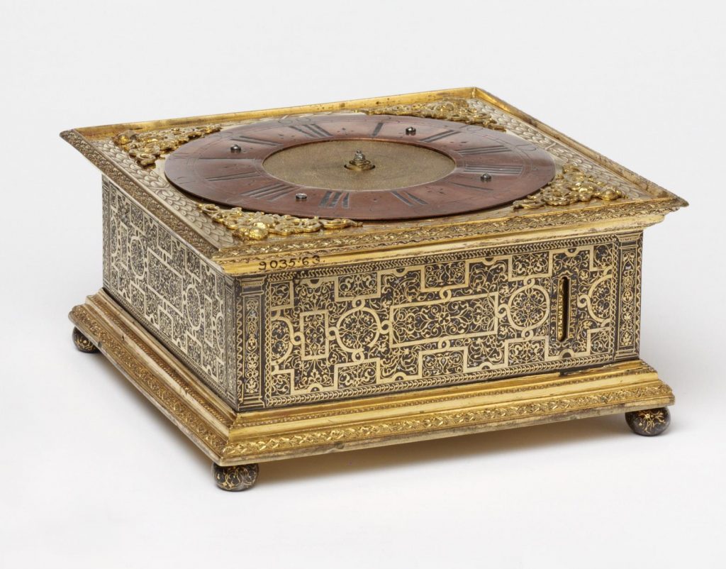 Table clock with alarm in square brass case on four bun feet