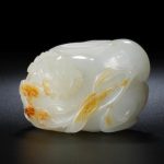 A very fine white jade and russet carving of a rabbit Qianlong