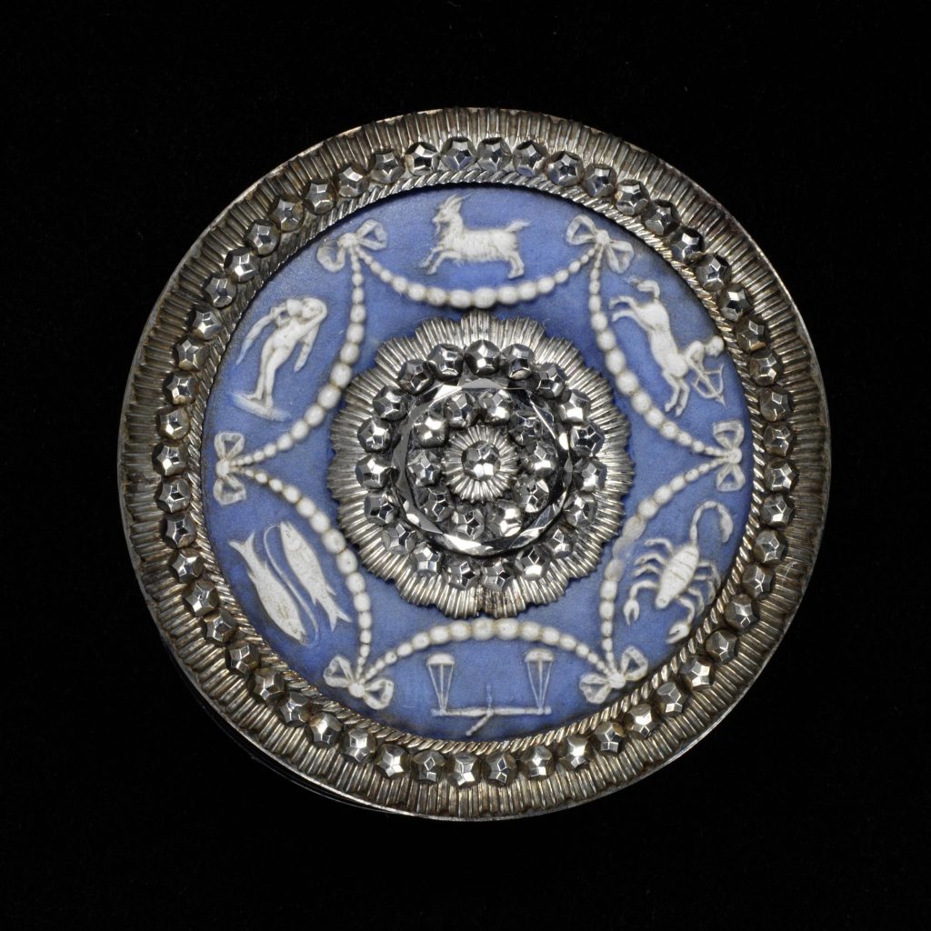 Button, cut steel frame, set with a jasper plaque, showing the signs of the Zodiac. The plaque made in the factory of Josiah Wedgwood (1730-95), the setting possibly by Matthew Boulton (1728-1809).
