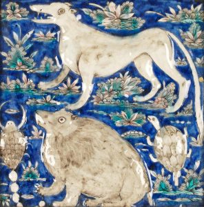 A Qajar underglaze-painted moulded pottery Tile with Astrological Signs Tehran, Persia, 19th Century